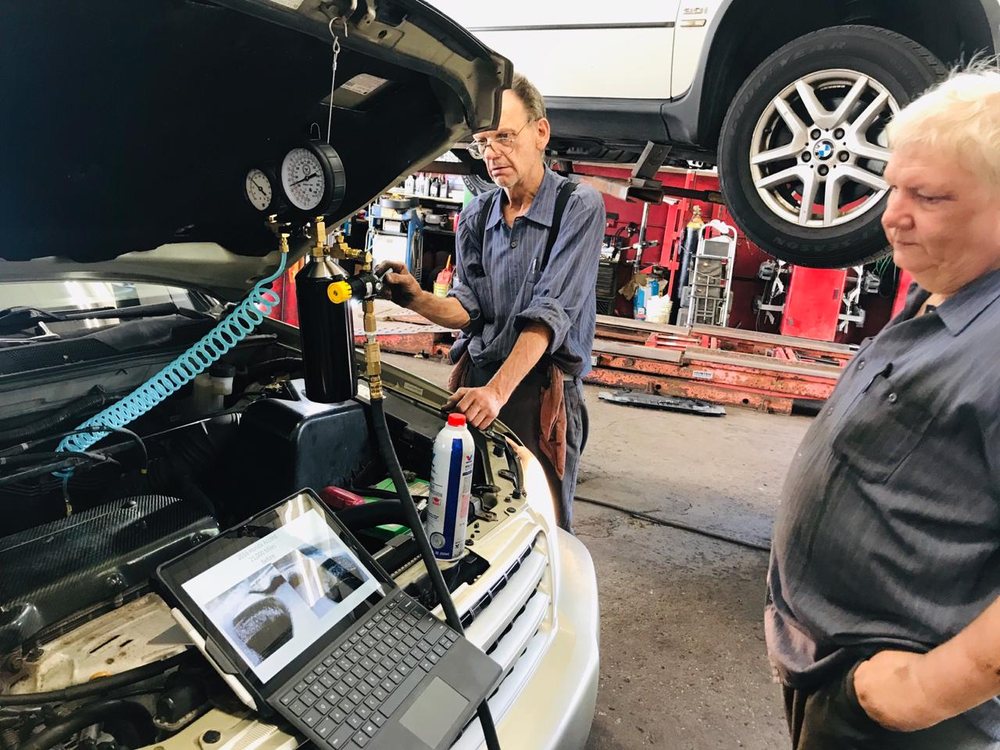 Technicians reviewing diagnostic results together